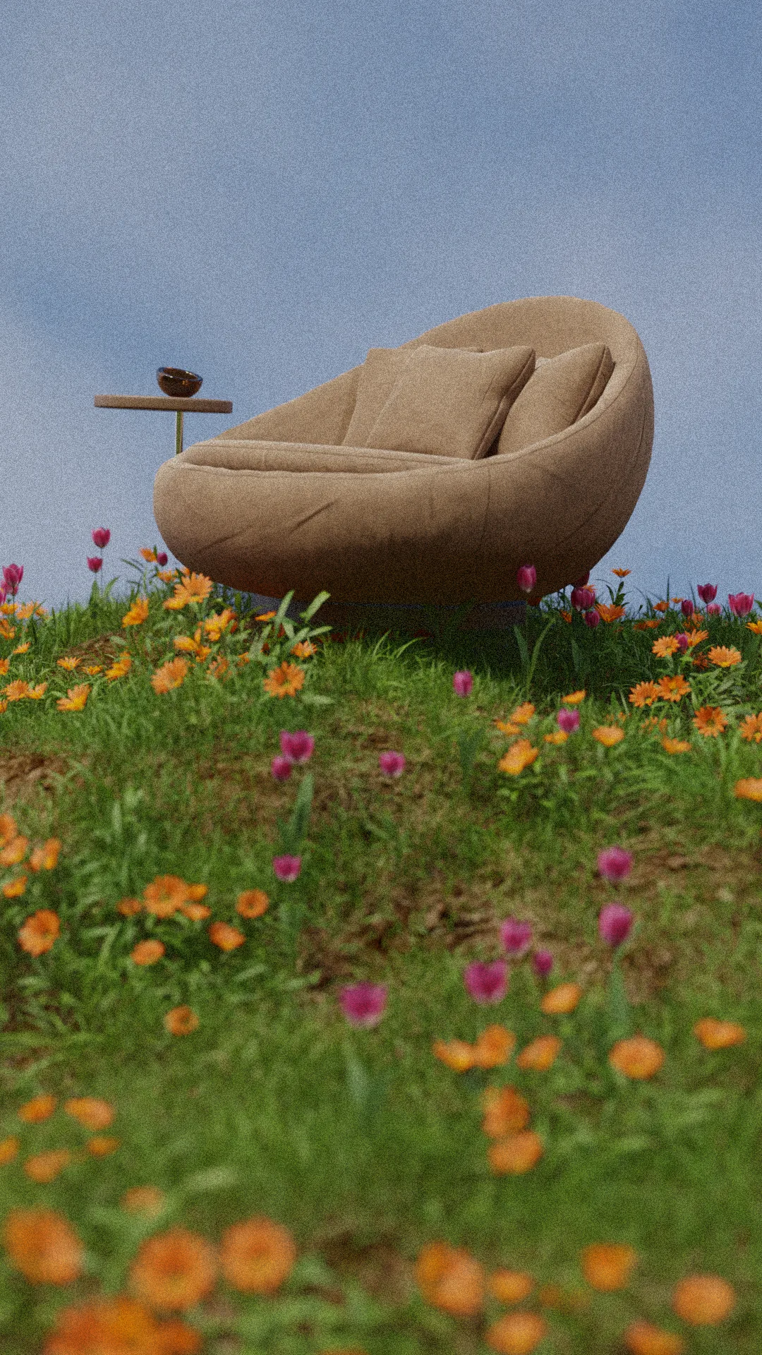 A round upholstered chair standing alone in a field of orange and pink flowers